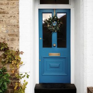 White exterior brick Front door painted Blue